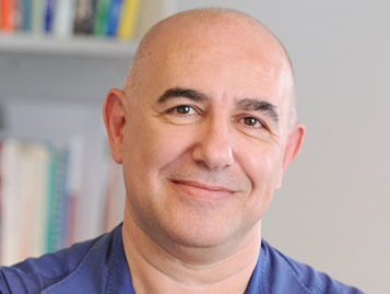 Adaptive Biomolecular Networks: From Emergent Living Computation to Cybergenetic Cell Therapy